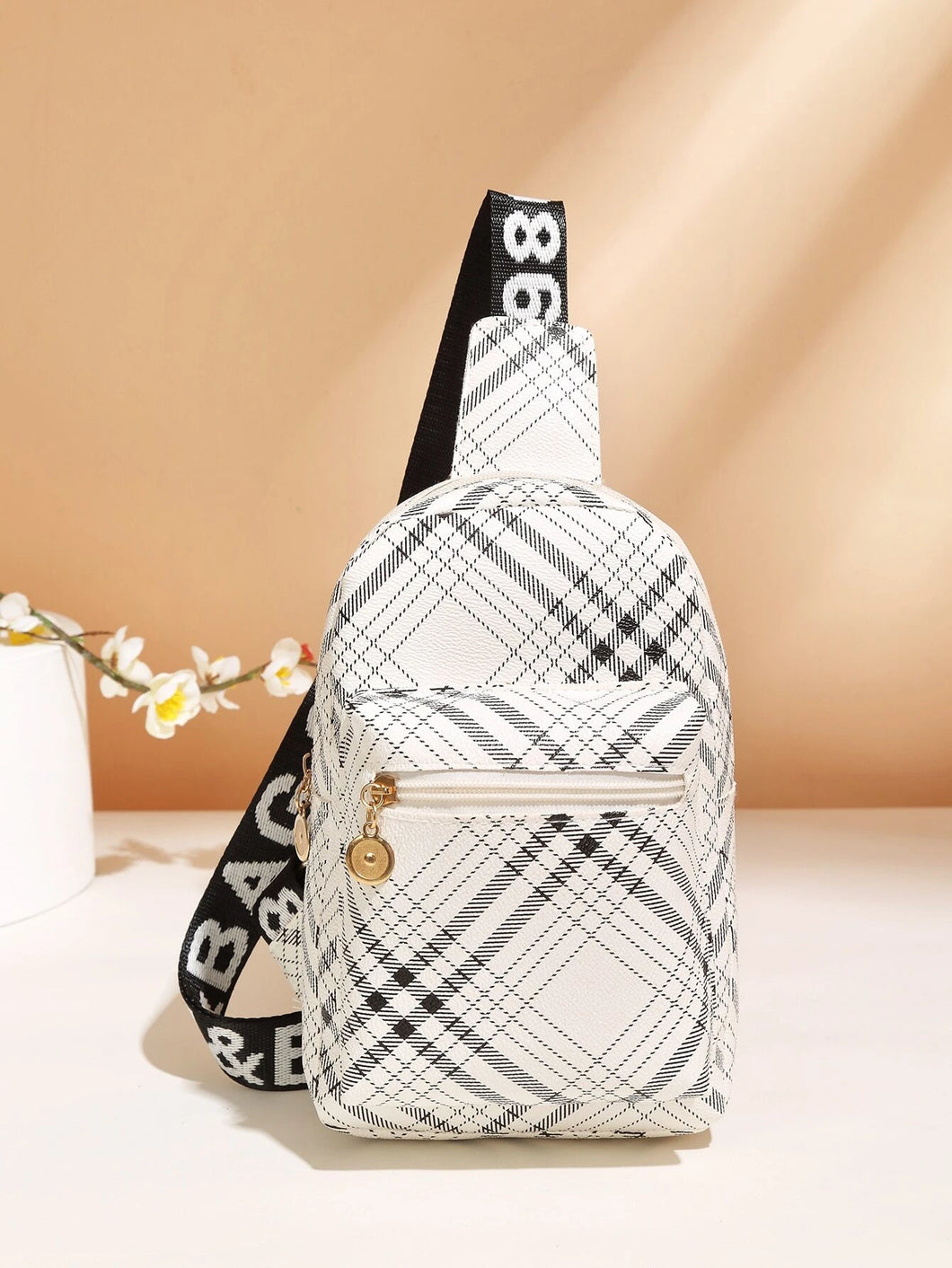 Bulto con bolsillo delantero y estampado a cuadros